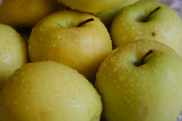 apples on a plate on the table in the kitchen. Chauntecleer apples.