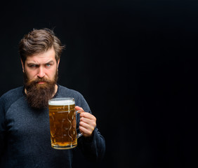Beer in Germany. Man tasting draft beer. Brewer. Brewery concept. Bearded man drinking ale. Oktoberfest festival. Craft beer at restaurant. Beer pub and bar. Bearded man hold glass with delicious ale.