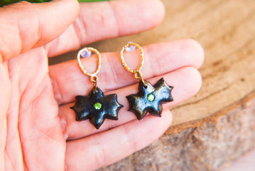 Halloween bat shape gold black earrings. Fastive jewelry.