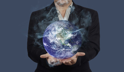 Man hold hot earth in hand ,Global warming concept.Elements of this image furnished by NASA