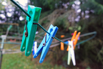 Close up of an old clothespins in outdoor parallel clothesline.