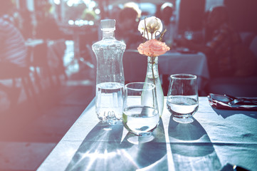 Empty outdoor restaurant table at sunset