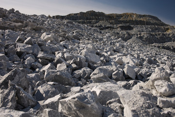 Destroyed rocks after the explosion inside a large quarry. Mining industry.