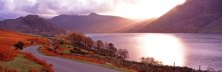 Warm panoramic autumn sunset over Buttermere in the Lake District Cumbria - obrazy, fototapety, plakaty