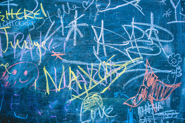 Multicolored drawings on blackboard