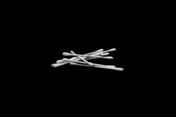 White and clean cotton buds with dark background textures