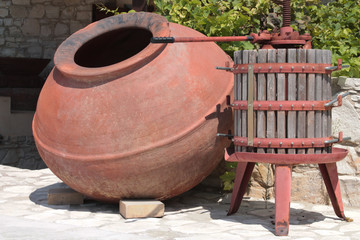Tank and press for cooking olive oil.