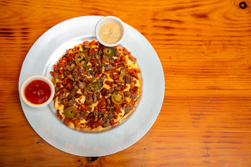 Pizza with meat and chili