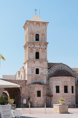 Obraz premium Church of St. Lazarus - front view. Tower with a bell and a cross, arched passage.