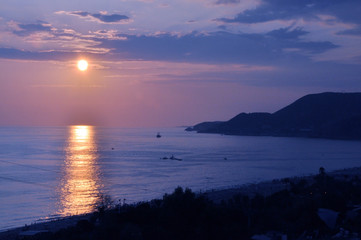 Very beautiful sunset over the sea in the early summer.