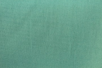 Abstract turquoise textile background with space for text and design