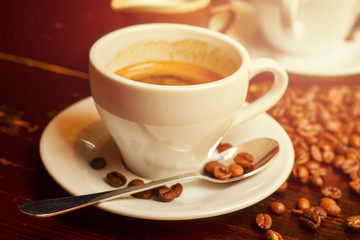Hot coffee and coffee beans on the table