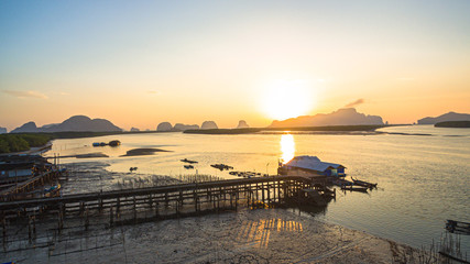 Obraz premium aerial view small fishing village. Bansamchong fishing village inside the large wetland