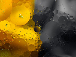 Colourful surreal psychedelic abstract liquid background. Water and oil drops with small air bubbles