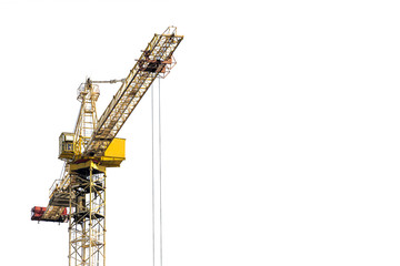 Yellow construction crane on a white isolated background builds multi-storey residential buildings using modern technologies of metal, concrete and brick according to the architectural design