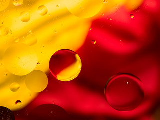 Colourful surreal psychedelic abstract liquid background. Water and oil drops with small air bubbles