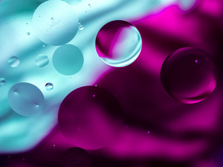 Colourful surreal psychedelic abstract liquid background. Water and oil drops with small air bubbles