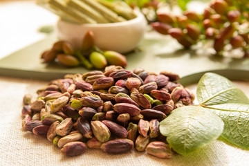 Sweet, delicate and fragrant nuts, Bronte pistachios with  brilliant green colour, ingredient for Italian cuisine, ice creams, cakes, pesto