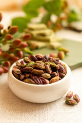 Sweet, delicate and fragrant nuts, Bronte pistachios with  brilliant green colour, ingredient for Italian cuisine, ice creams, cakes, pesto