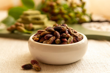 Sweet, delicate and fragrant nuts, Bronte pistachios with  brilliant green colour, ingredient for Italian cuisine, ice creams, cakes, pesto