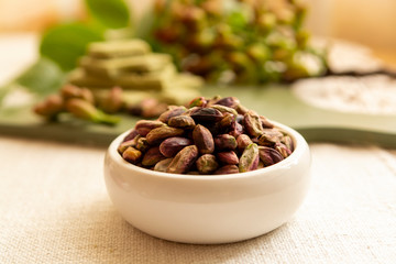 Sweet, delicate and fragrant nuts, Bronte pistachios with  brilliant green colour, ingredient for Italian cuisine, ice creams, cakes, pesto