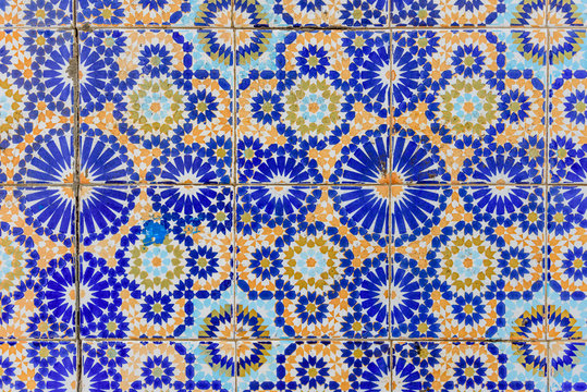 Old wall decorated with beautiful mosaics in Marrakech, Morocco