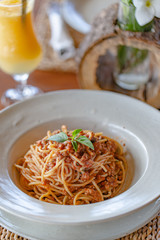 Pasta served with tomato sauce and meat. Spaghetti in bolognese sauce.