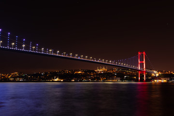 The Bosphorus Bridge or the 15 July Martyrs Bridge, view on the Asian side of night Istanbul, Turkey