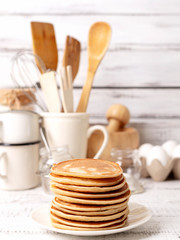 Cooking pancakes. Ingredients, crockery and kitchenware for pancakes.