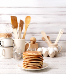 Cooking pancakes. Ingredients, crockery and kitchenware for pancakes.