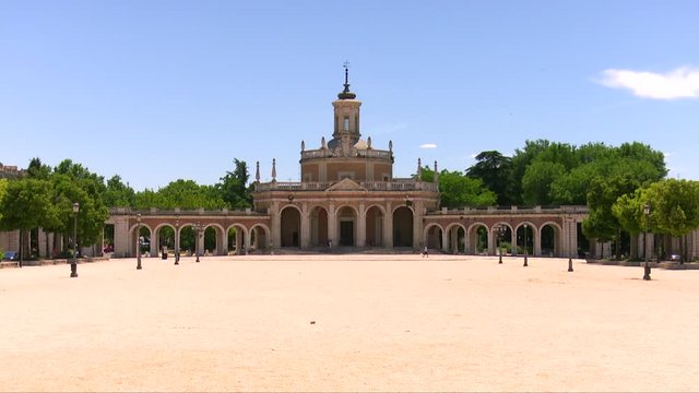 Beautiful view of the San Antonio church in the famous Plaza de San Antonio in Aranjuez, Spain, a hot spring day, June, sunny and a blue sky