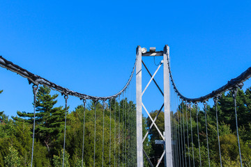 Pier and cable of suspension bridge, Gorge park, Coaticook, Quebec