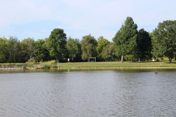 A beautiful view of the lake in the country on a sunny day.
