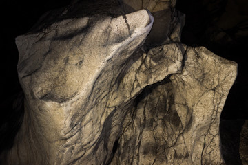 Impressive, alien shapes inside the massive cave and dark, spooky background