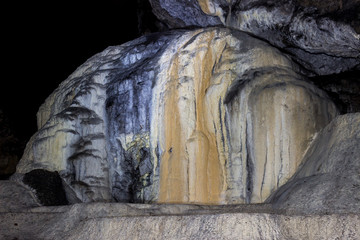 Impressive, alien shapes inside the massive cave and dark, spooky background