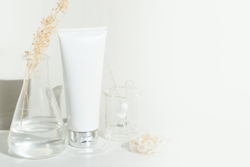 beauty spa medical skincare and cosmetic lotion bottle cream packaging product on white decor background and laboratory test glass tube in doctor healthy science concept