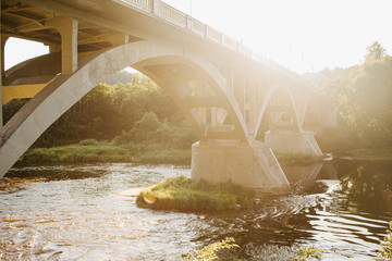 Bridge over river in sun