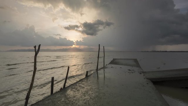 Timelapse gorgeous sunset and raining together at fisherman bridge at Juru, Penang, Malaysia.