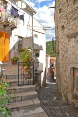 Carpinone, Italy, 09/05/2017. A narrow street among the houses of a rural village, embellished with...
