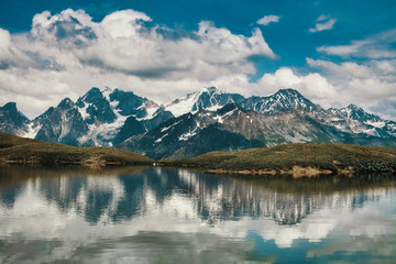 Obraz na płótnie Canvas Mountains reflected in the lake. Beautiful landscape. Lake Koruldi, region Mestia, Georgia. Caucasian ridge.