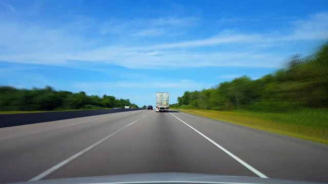 *Drunk Intoxication Blurred Motion Version* *Drafting Large Truck on Highway During Summer Day.  Driver Point of View POV Slipstreaming by Following Vehicle on Interstate