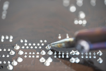 Soldering with a soldering iron on a chip