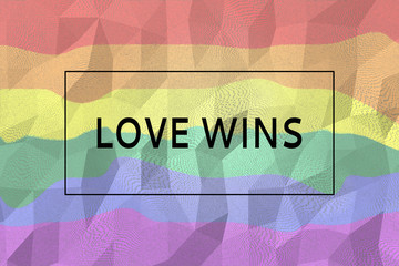 Digitally generated sign with tag love wins on lgbt rainbow colored background