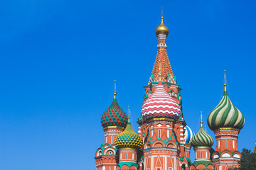 Fototapeta na wymiar St. Basil's Cathedral (St. Basil's Cathedral) close-up of architecture on Red Square in Moscow, Russia. Domes of the temple, the church against the clear sky