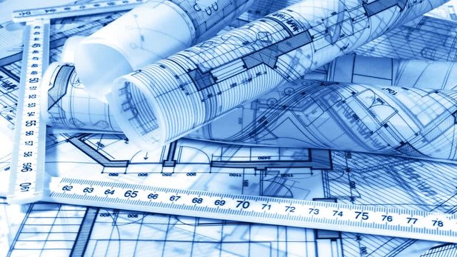 Blueprints - architectural drawings, yardstick - folding ruler and drawing of the golden section smoothly rotate on the surface of the architectural plan of a modern house