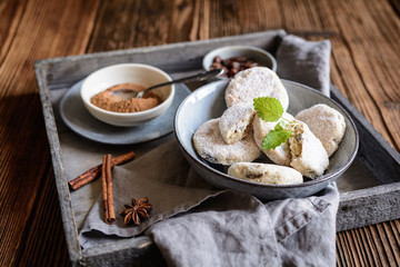 Classic Welsh cakes with raisins, sprinkled with powdered sugar