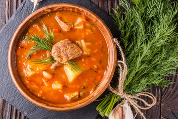 Chanahi a traditional Georgian meat stew in a bowl on stoyn board