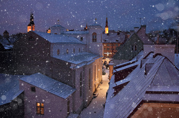 dormer and roofs of a medieval city in winter