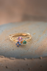 A beautiful gold ring with colorful gemstones