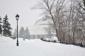 Snowy walkway in town during winter